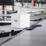 Sliding shoe sortation conveyor, Hytrol stock image